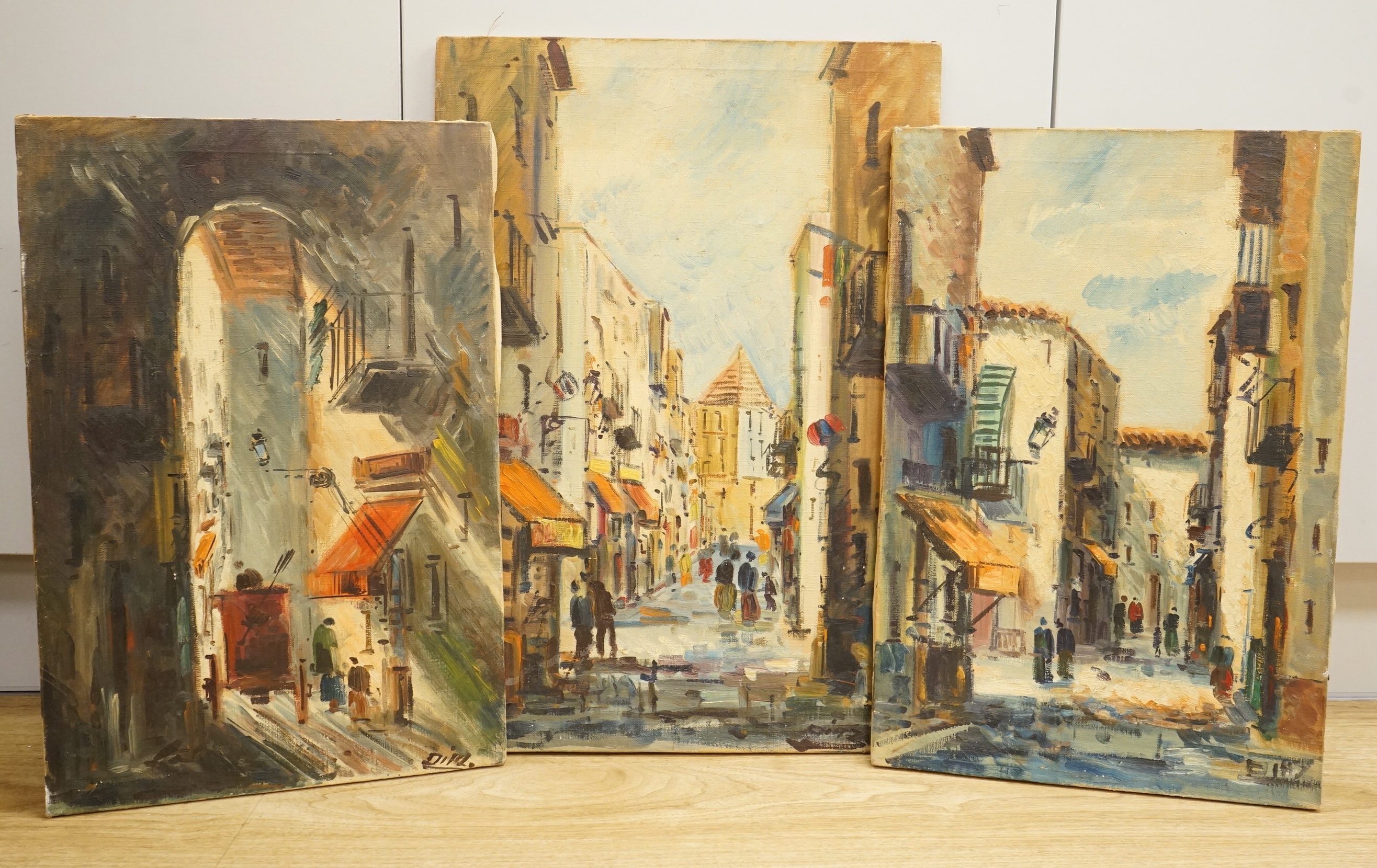 Diaz, Street scenes, each signed, three oils on canvas, unframed, largest 55 x 38cm
